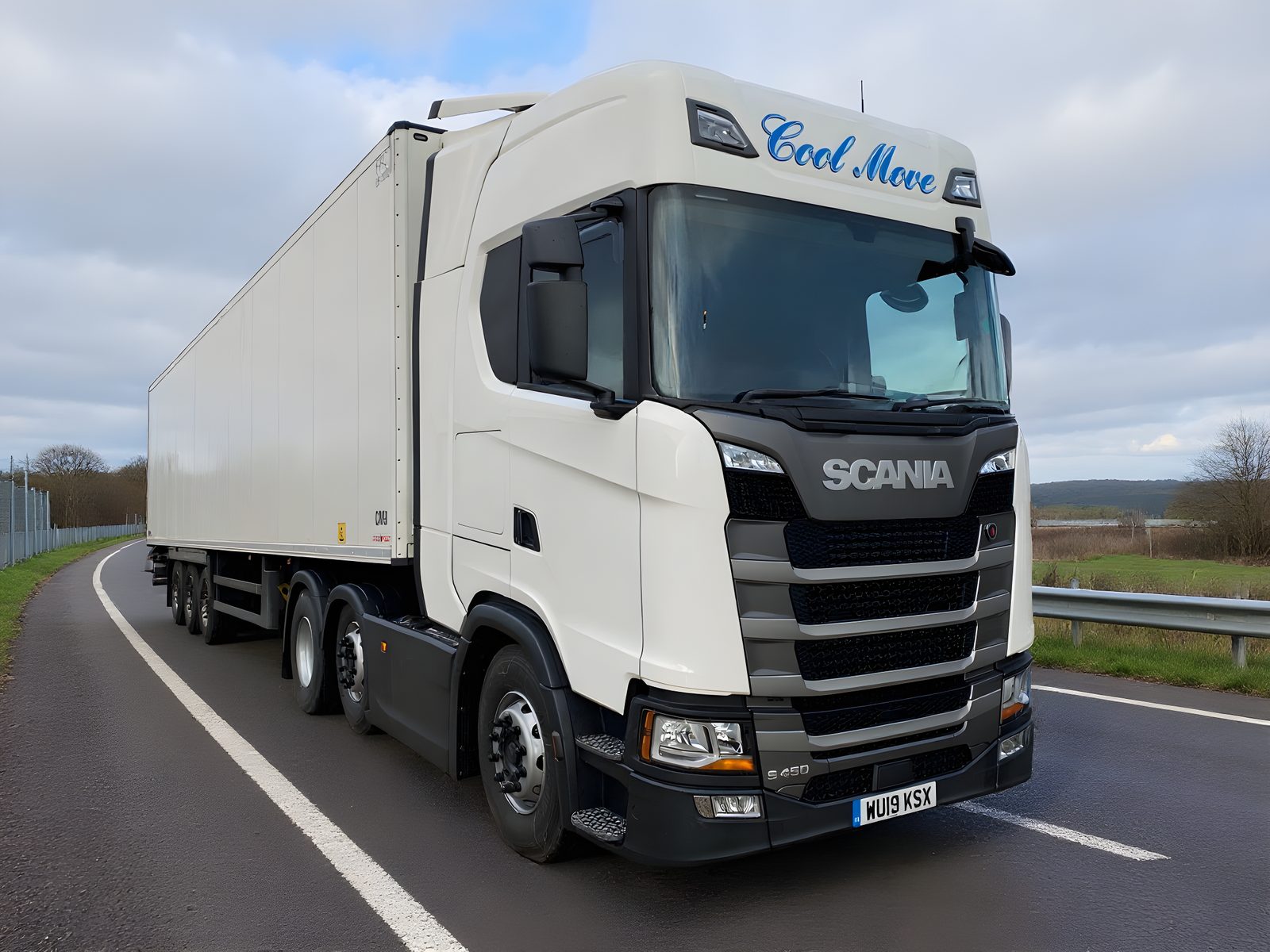 A white Scania S450 Cool Move tractor unit pulling a white Chereau refrigerated trailer, photographed three-quarter front beside a steel security gate.